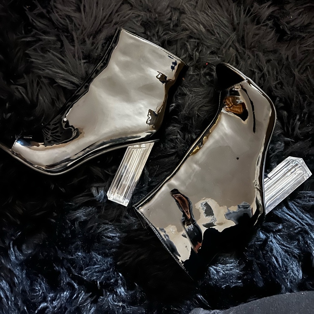 Patent leather peep toe booties with clear 4 inch block heel. Never been worn.